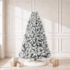 Unlit snow-flocked pinecone artificial Christmas tree in a bright room