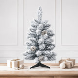 Compact snow-flocked pinecone artificial Christmas tree with plastic stand