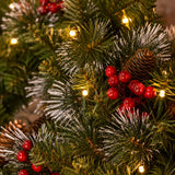 Warm white LED lights among red berries and pinecones on the wreath