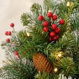 Red berry and pinecone detail on the pre-lit Christmas wreath