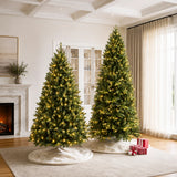 Two pre-lit memory-wire Christmas trees glowing with warm white lights in a living room