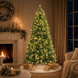 Pre-lit green PVC Christmas tree glowing beside a fireplace