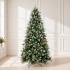 Snow-kissed artificial Christmas tree with red berries and pinecones in a bright room