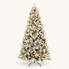 Snow-flocked pre-lit artificial Christmas tree with warm glowing globe lights